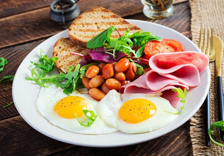 English Breakfast With Fried Egg Beans Tomatoes Sausage Ham And Toast